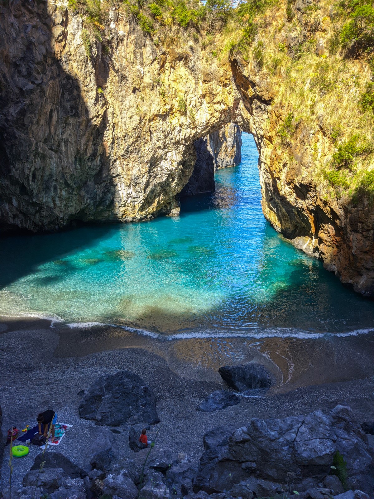 Mother and child on Arcomagno beach