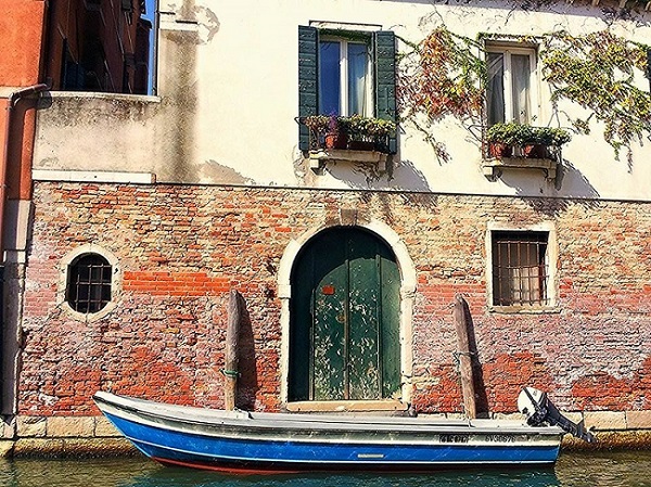 Blue boat on Venetian Canal