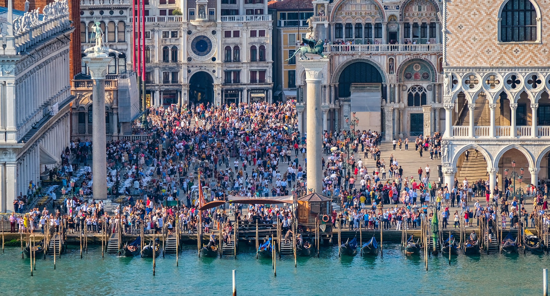 Venice in Summer is wonderful. Colorful flower boxes add a splash of red while the gondolas ply their way up canals, sparkling aquamarine in the summer sunshine