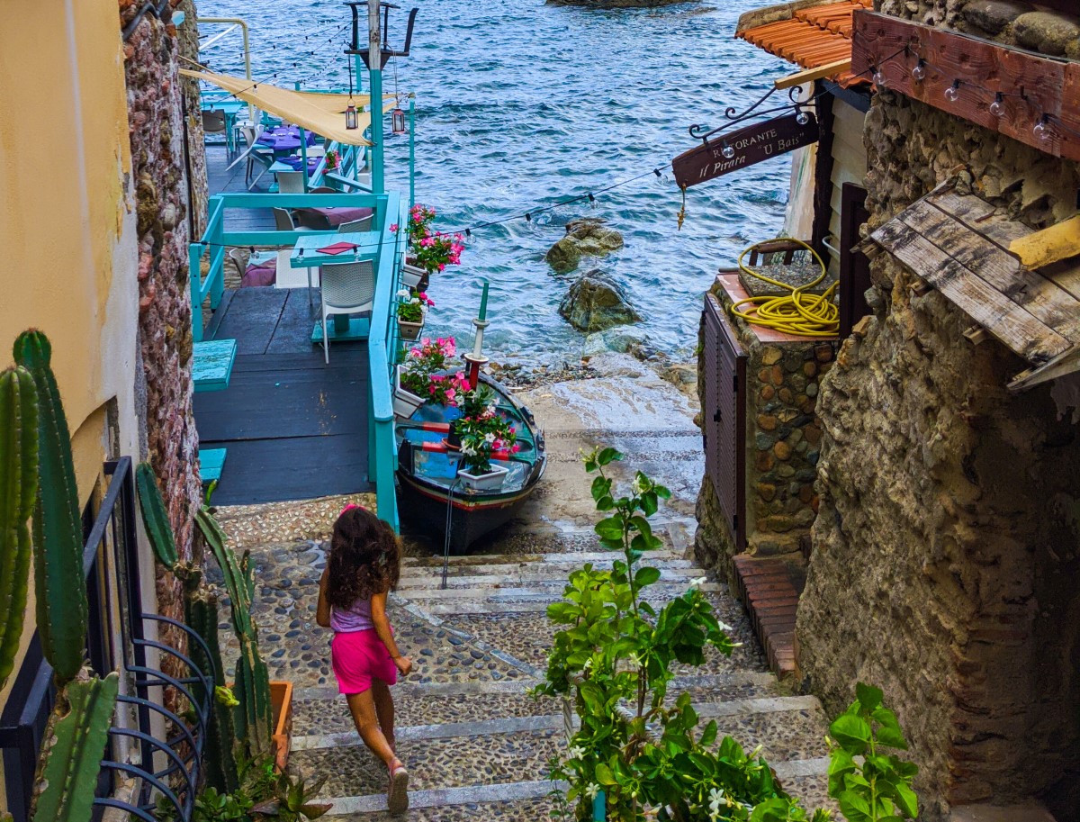 Girl running in Chianalea, Calabria Girl running in Chianalea, Calabria