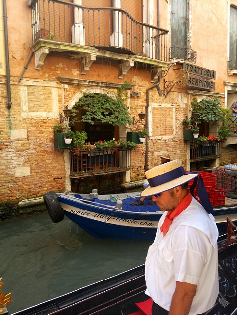 The sad gondolier in Venice Italy
